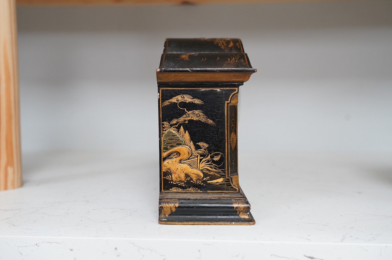 An early 20th century chinoiserie lacquer clock, 29cm wide. Condition - fair to good, currently ticking